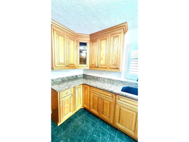 Discover this beautifully upgraded 2-bedroom, 2-bath corner unit on Pine Island Ridge Country Club in Florida - for sale on GolfHomes.com, golf home, golf lot