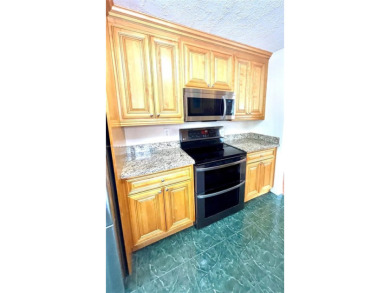 Discover this beautifully upgraded 2-bedroom, 2-bath corner unit on Pine Island Ridge Country Club in Florida - for sale on GolfHomes.com, golf home, golf lot