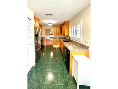 Discover this beautifully upgraded 2-bedroom, 2-bath corner unit on Pine Island Ridge Country Club in Florida - for sale on GolfHomes.com, golf home, golf lot