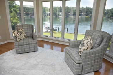 This exceptional lakefront home, located in Seven Lakes West on Beacon Ridge Golf and Country Club in North Carolina - for sale on GolfHomes.com, golf home, golf lot