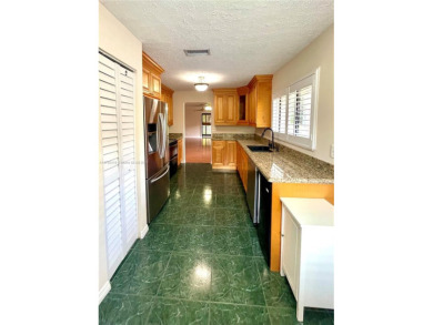Discover this beautifully upgraded 2-bedroom, 2-bath corner unit on Pine Island Ridge Country Club in Florida - for sale on GolfHomes.com, golf home, golf lot