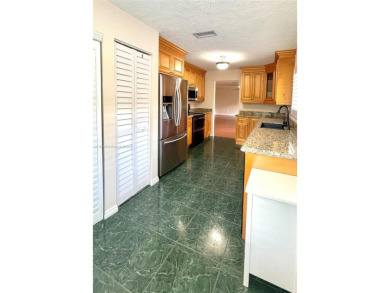 Discover this beautifully upgraded 2-bedroom, 2-bath corner unit on Pine Island Ridge Country Club in Florida - for sale on GolfHomes.com, golf home, golf lot
