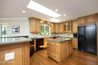 This exceptional lakefront home, located in Seven Lakes West on Beacon Ridge Golf and Country Club in North Carolina - for sale on GolfHomes.com, golf home, golf lot