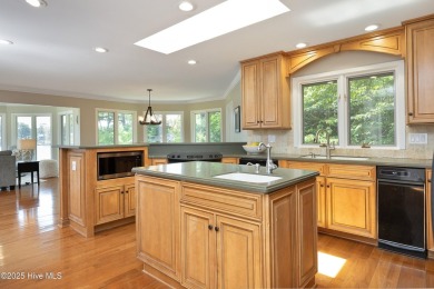 This exceptional lakefront home, located in Seven Lakes West on Beacon Ridge Golf and Country Club in North Carolina - for sale on GolfHomes.com, golf home, golf lot