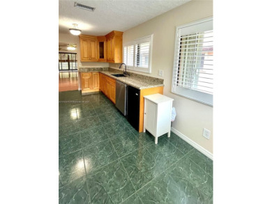 Discover this beautifully upgraded 2-bedroom, 2-bath corner unit on Pine Island Ridge Country Club in Florida - for sale on GolfHomes.com, golf home, golf lot