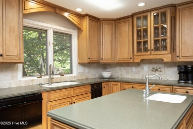 This exceptional lakefront home, located in Seven Lakes West on Beacon Ridge Golf and Country Club in North Carolina - for sale on GolfHomes.com, golf home, golf lot