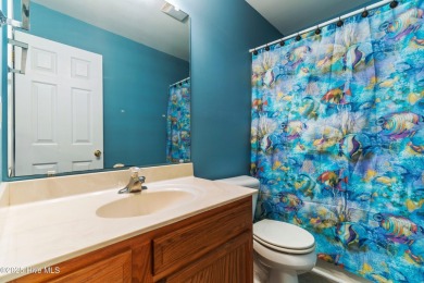 Enjoy the ease of one-level living in this low-maintenance on Masonboro Country Club in North Carolina - for sale on GolfHomes.com, golf home, golf lot