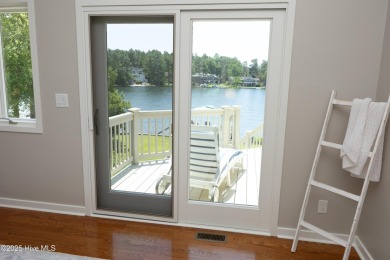 This exceptional lakefront home, located in Seven Lakes West on Beacon Ridge Golf and Country Club in North Carolina - for sale on GolfHomes.com, golf home, golf lot