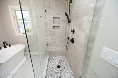 This exceptional lakefront home, located in Seven Lakes West on Beacon Ridge Golf and Country Club in North Carolina - for sale on GolfHomes.com, golf home, golf lot