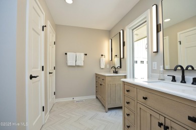 This exceptional lakefront home, located in Seven Lakes West on Beacon Ridge Golf and Country Club in North Carolina - for sale on GolfHomes.com, golf home, golf lot