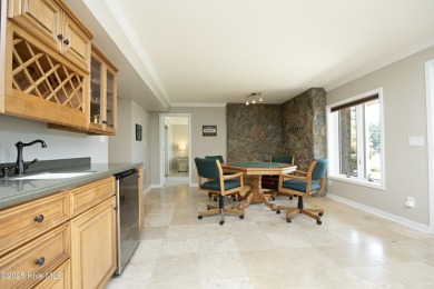 This exceptional lakefront home, located in Seven Lakes West on Beacon Ridge Golf and Country Club in North Carolina - for sale on GolfHomes.com, golf home, golf lot