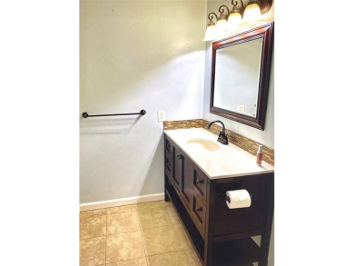 Discover this beautifully upgraded 2-bedroom, 2-bath corner unit on Pine Island Ridge Country Club in Florida - for sale on GolfHomes.com, golf home, golf lot
