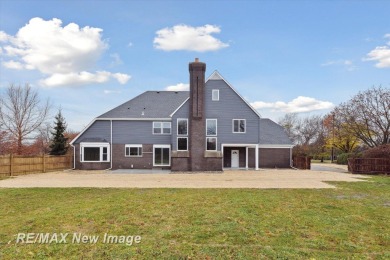 This stunning 5 bedroom home on the golf course at Saginaw on Saginaw Country Club in Michigan - for sale on GolfHomes.com, golf home, golf lot