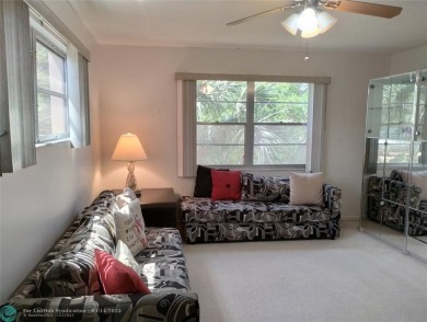 BRIGHT & SPACIOUS CORNER OVERLOOKING THE POOL AREA & SURROUNDING on Wynmoor Golf Course in Florida - for sale on GolfHomes.com, golf home, golf lot