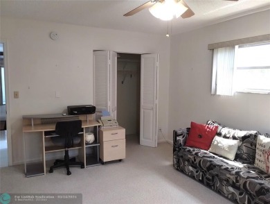 BRIGHT & SPACIOUS CORNER OVERLOOKING THE POOL AREA & SURROUNDING on Wynmoor Golf Course in Florida - for sale on GolfHomes.com, golf home, golf lot
