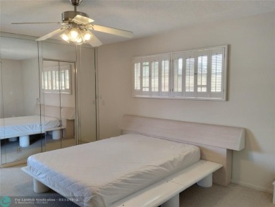 BRIGHT & SPACIOUS CORNER OVERLOOKING THE POOL AREA & SURROUNDING on Wynmoor Golf Course in Florida - for sale on GolfHomes.com, golf home, golf lot