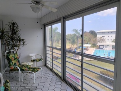 BRIGHT & SPACIOUS CORNER OVERLOOKING THE POOL AREA & SURROUNDING on Wynmoor Golf Course in Florida - for sale on GolfHomes.com, golf home, golf lot