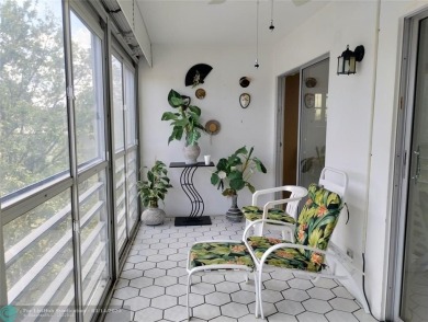 BRIGHT & SPACIOUS CORNER OVERLOOKING THE POOL AREA & SURROUNDING on Wynmoor Golf Course in Florida - for sale on GolfHomes.com, golf home, golf lot