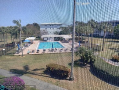 BRIGHT & SPACIOUS CORNER OVERLOOKING THE POOL AREA & SURROUNDING on Wynmoor Golf Course in Florida - for sale on GolfHomes.com, golf home, golf lot