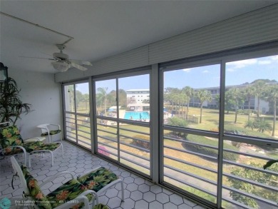 BRIGHT & SPACIOUS CORNER OVERLOOKING THE POOL AREA & SURROUNDING on Wynmoor Golf Course in Florida - for sale on GolfHomes.com, golf home, golf lot
