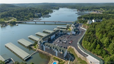 Enjoy breathtaking views of the lake from this stunning on The Club At Old Kinderhook in Missouri - for sale on GolfHomes.com, golf home, golf lot