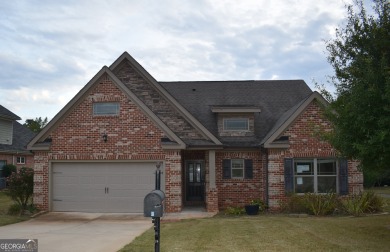 A stunning 4-sided brick ranch home perfectly situated within on Crystal Lake Golf and Country Club in Georgia - for sale on GolfHomes.com, golf home, golf lot