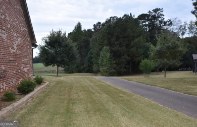 A stunning 4-sided brick ranch home perfectly situated within on Crystal Lake Golf and Country Club in Georgia - for sale on GolfHomes.com, golf home, golf lot