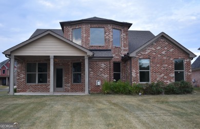 A stunning 4-sided brick ranch home perfectly situated within on Crystal Lake Golf and Country Club in Georgia - for sale on GolfHomes.com, golf home, golf lot