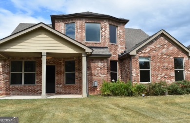 A stunning 4-sided brick ranch home perfectly situated within on Crystal Lake Golf and Country Club in Georgia - for sale on GolfHomes.com, golf home, golf lot
