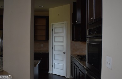A stunning 4-sided brick ranch home perfectly situated within on Crystal Lake Golf and Country Club in Georgia - for sale on GolfHomes.com, golf home, golf lot