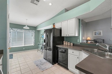 Experience relaxed Florida living in this well-maintained on Tampa Bay Golf and Country Club in Florida - for sale on GolfHomes.com, golf home, golf lot