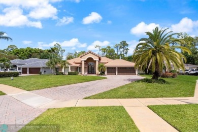 Desirable Grand Cayman model with Screened-in pool with spa on Binks Forest Golf Club in Florida - for sale on GolfHomes.com, golf home, golf lot