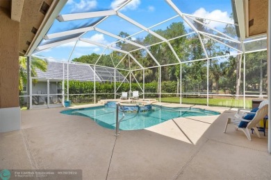 Desirable Grand Cayman model with Screened-in pool with spa on Binks Forest Golf Club in Florida - for sale on GolfHomes.com, golf home, golf lot