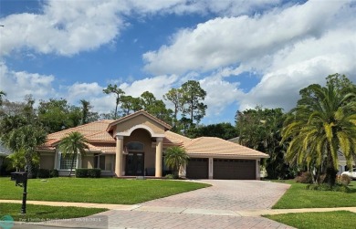 Desirable Grand Cayman model with Screened-in pool with spa on Binks Forest Golf Club in Florida - for sale on GolfHomes.com, golf home, golf lot