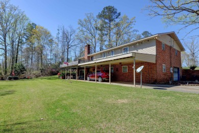 The 4 bedroom, 3 bath ranch style home you're interested in is a on Choctaw Country Club in Alabama - for sale on GolfHomes.com, golf home, golf lot