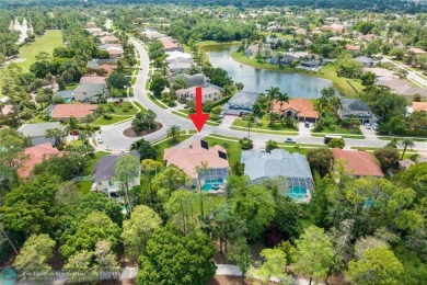 Desirable Grand Cayman model with Screened-in pool with spa on Binks Forest Golf Club in Florida - for sale on GolfHomes.com, golf home, golf lot