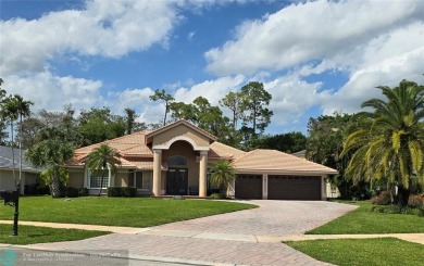 Desirable Grand Cayman model with Screened-in pool with spa on Binks Forest Golf Club in Florida - for sale on GolfHomes.com, golf home, golf lot