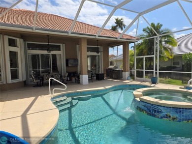 Desirable Grand Cayman model with Screened-in pool with spa on Binks Forest Golf Club in Florida - for sale on GolfHomes.com, golf home, golf lot