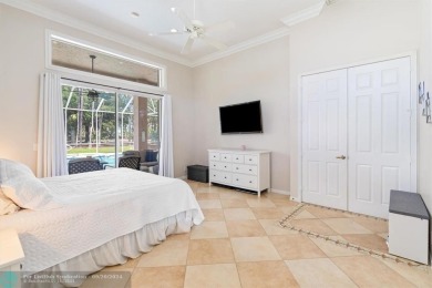 Desirable Grand Cayman model with Screened-in pool with spa on Binks Forest Golf Club in Florida - for sale on GolfHomes.com, golf home, golf lot