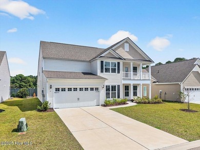 Experience elevated coastal living in this luxury 4-bedroom home on Crow Creek Golf Club in North Carolina - for sale on GolfHomes.com, golf home, golf lot