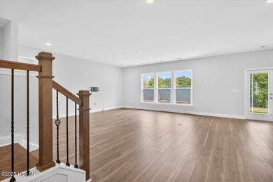 Experience elevated coastal living in this luxury 4-bedroom home on Crow Creek Golf Club in North Carolina - for sale on GolfHomes.com, golf home, golf lot