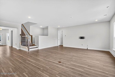 Experience elevated coastal living in this luxury 4-bedroom home on Crow Creek Golf Club in North Carolina - for sale on GolfHomes.com, golf home, golf lot