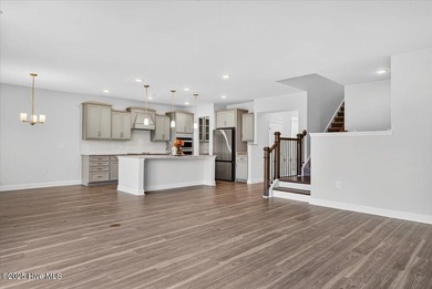 Experience elevated coastal living in this luxury 4-bedroom home on Crow Creek Golf Club in North Carolina - for sale on GolfHomes.com, golf home, golf lot