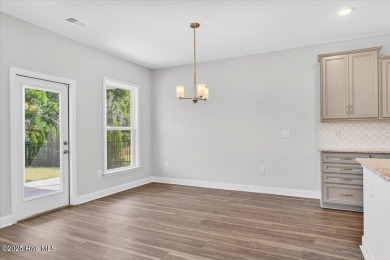 Discover this beautiful 4-bedroom, 2.5-bath home in the highly on Crow Creek Golf Club in North Carolina - for sale on GolfHomes.com, golf home, golf lot