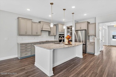 Experience elevated coastal living in this luxury 4-bedroom home on Crow Creek Golf Club in North Carolina - for sale on GolfHomes.com, golf home, golf lot