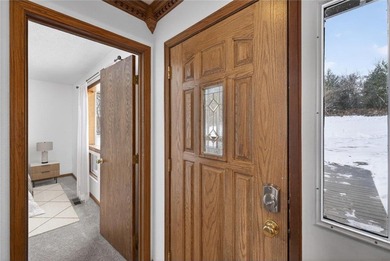 Nestled among the distinctive homes surrounding Coffee Mill Golf on Coffee Mill Golf and Country Club in Minnesota - for sale on GolfHomes.com, golf home, golf lot