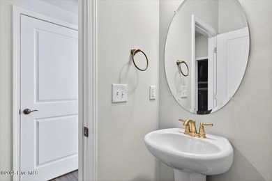 Experience elevated coastal living in this luxury 4-bedroom home on Crow Creek Golf Club in North Carolina - for sale on GolfHomes.com, golf home, golf lot