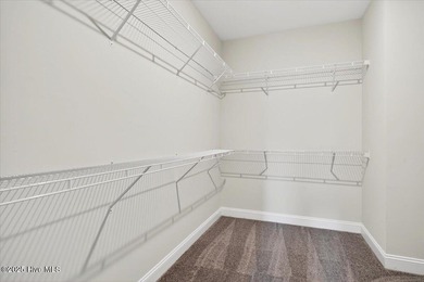 Experience elevated coastal living in this luxury 4-bedroom home on Crow Creek Golf Club in North Carolina - for sale on GolfHomes.com, golf home, golf lot