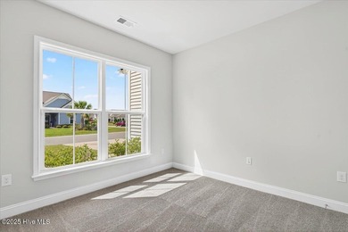 Experience elevated coastal living in this luxury 4-bedroom home on Crow Creek Golf Club in North Carolina - for sale on GolfHomes.com, golf home, golf lot