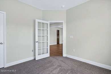 Experience elevated coastal living in this luxury 4-bedroom home on Crow Creek Golf Club in North Carolina - for sale on GolfHomes.com, golf home, golf lot